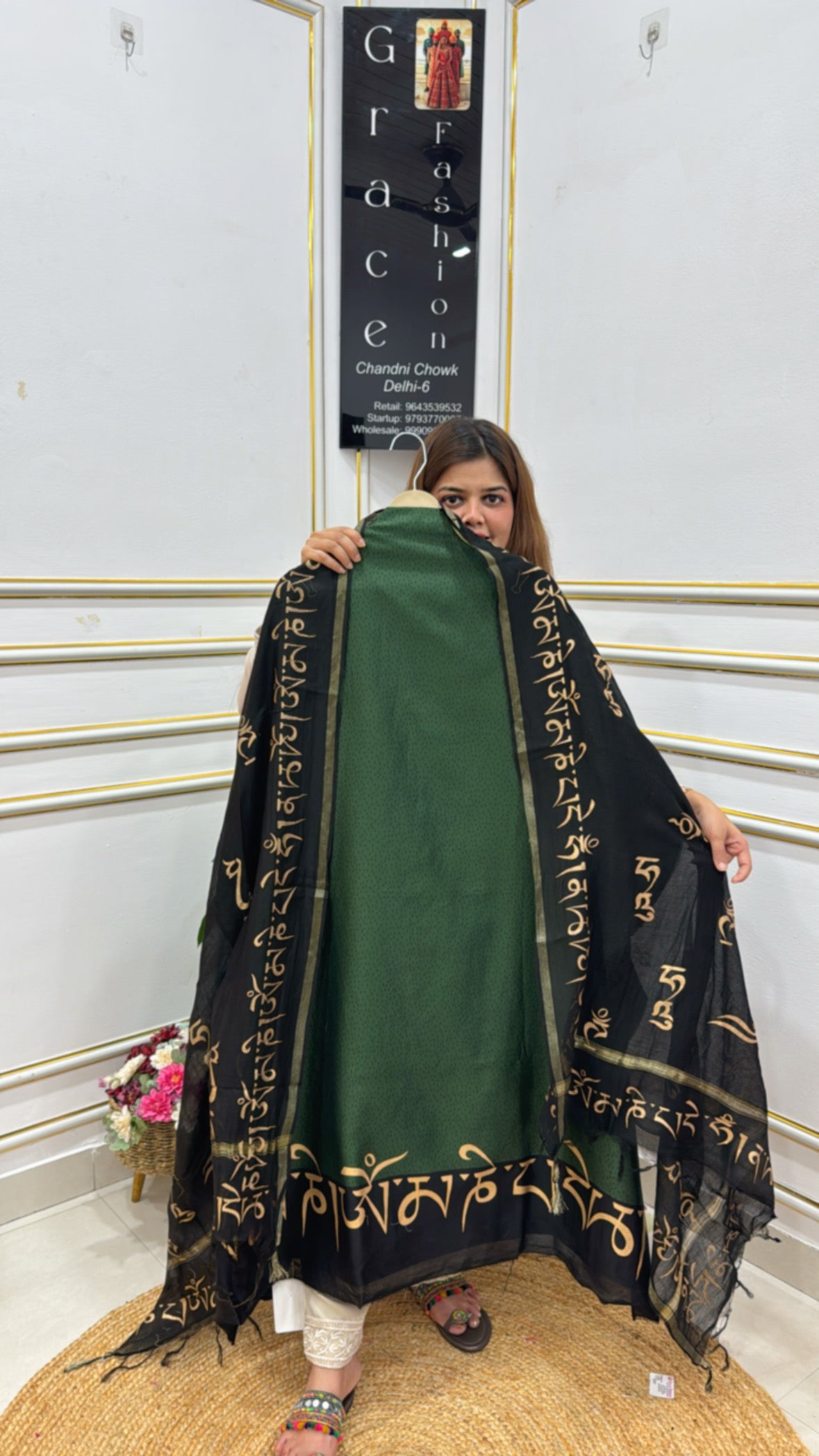 Black and green premium cotton silk suits with intricate golden embroidery and elegant drape